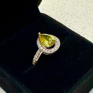 Silver Ring with Green Pear Cut Gem and Halo